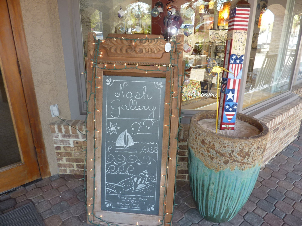 Hand-drawn Nash Gallery chalkboard sign outside the gallery
