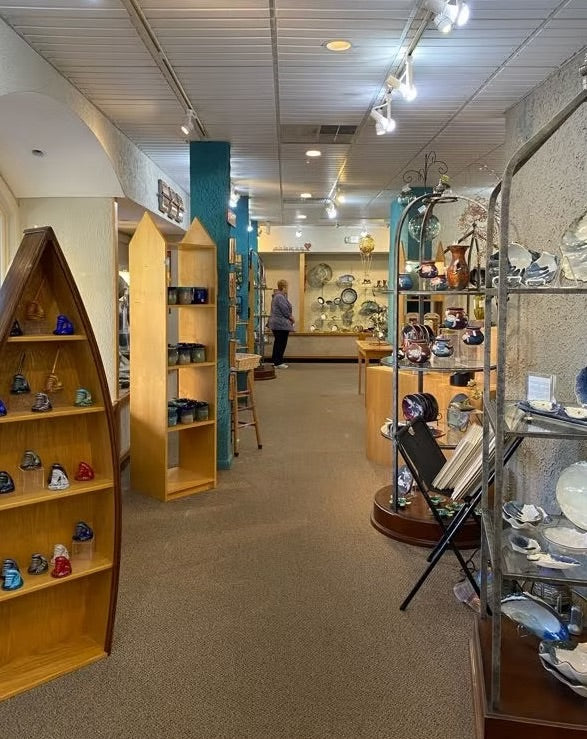 Inside Nash Gallery, showing handcrafted pottery and glass on display