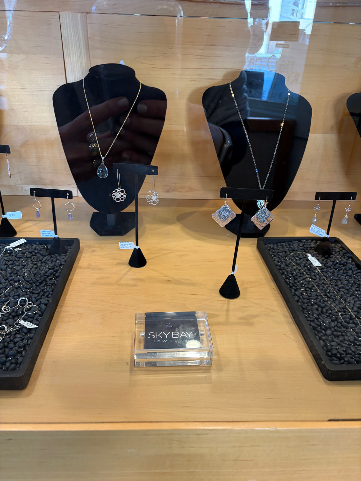 SkyBay Jewelry on display in the front case at Nash Gallery