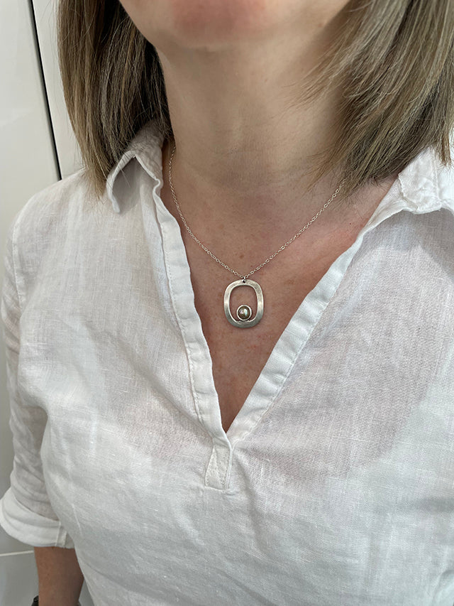 A SkyBay Jewelry necklace worn at the neck